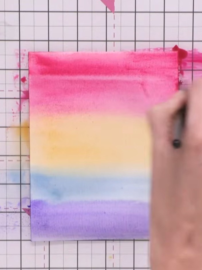 Step 4: Squeeze all water from your brush. Use the dry brush to lift out colour in a circular motion in the pink secti