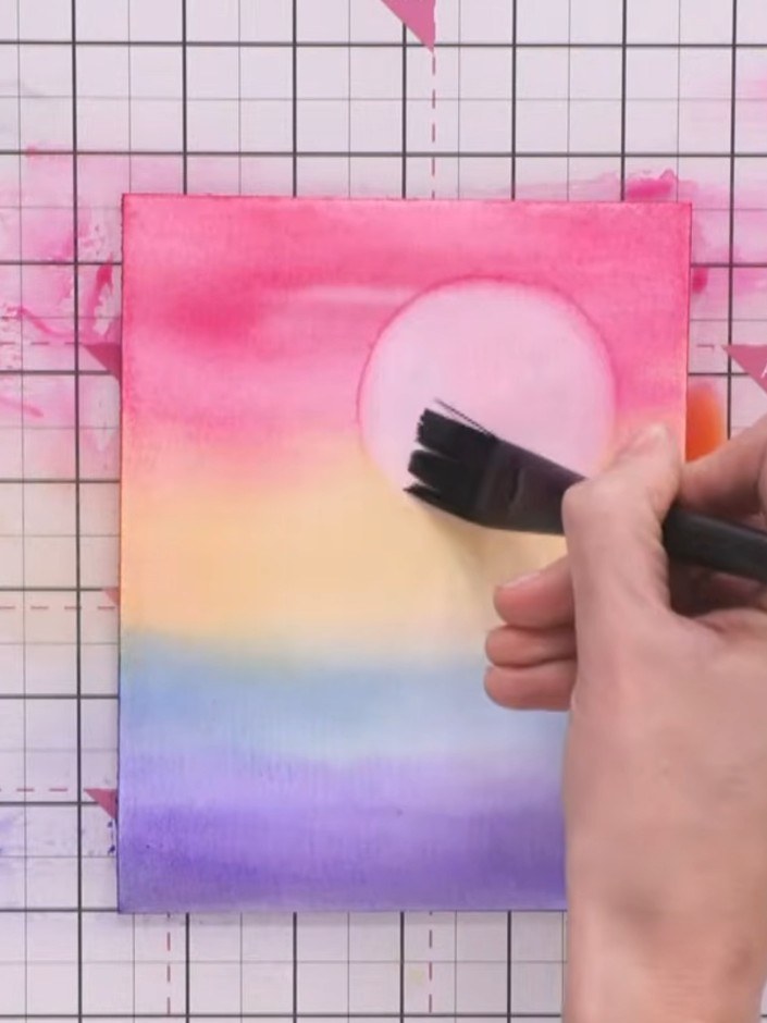 Step 6: Create water ripples by using a wet brush to add horizontal lines across the lower blue section. Lift colour w