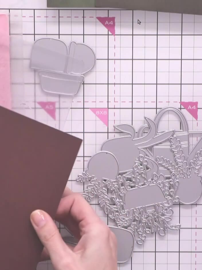 Step 1: Cut a piece of brown cardstock to size. Position the brown cardstock on your die-cutting machine plate with th