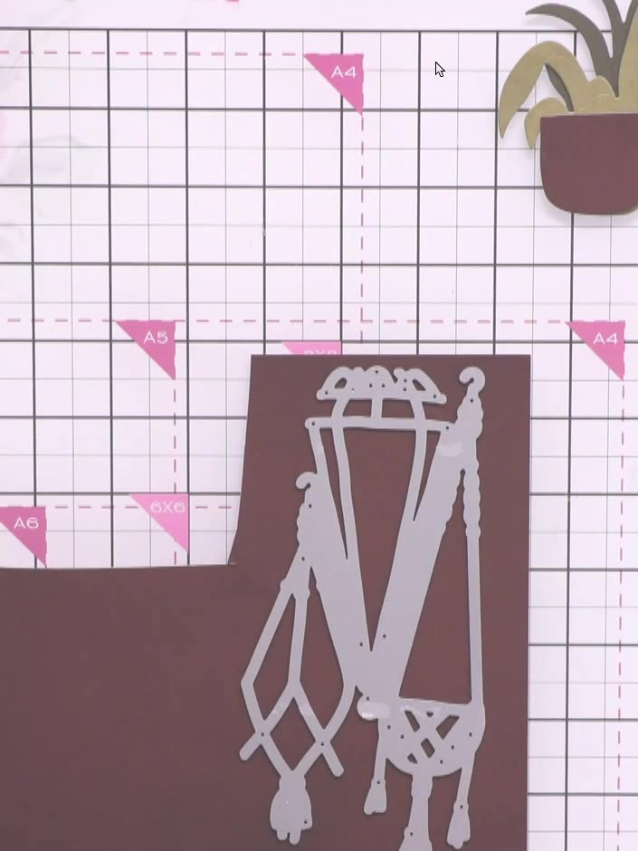 Step 1: Cut the macramé hanging basket die from brown cardstock. Position the die on your brown cardstock and run it t