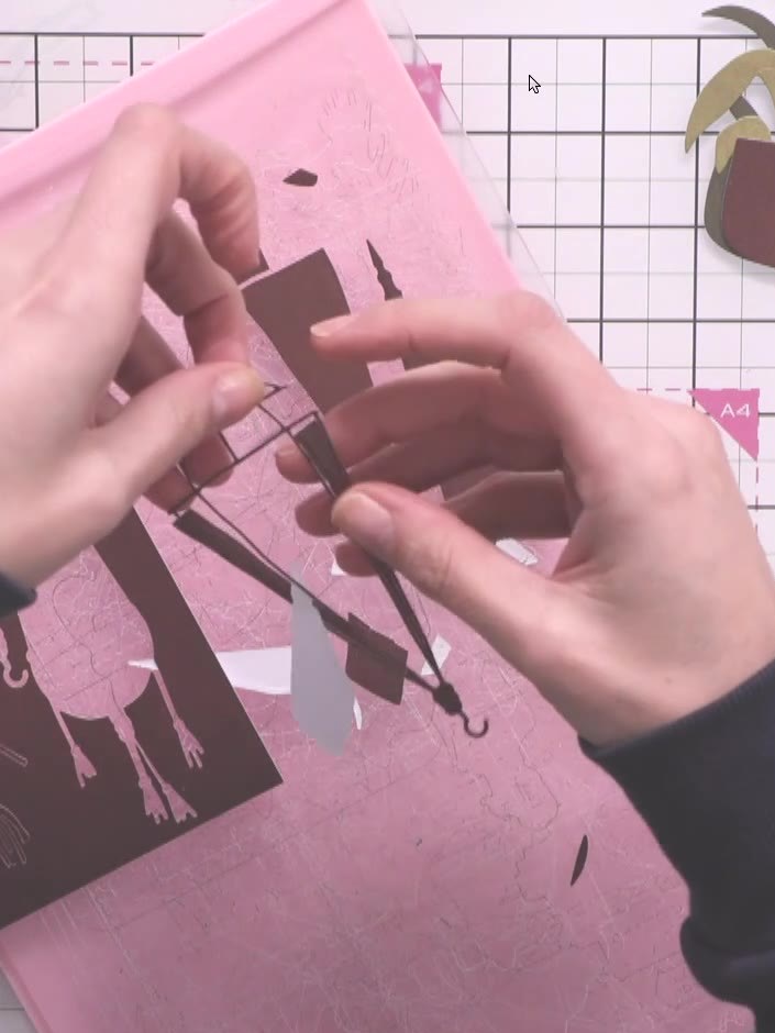 Step 2: Carefully pop out all the small pieces from the brown basket die-cut, including the tassels and decorative ele