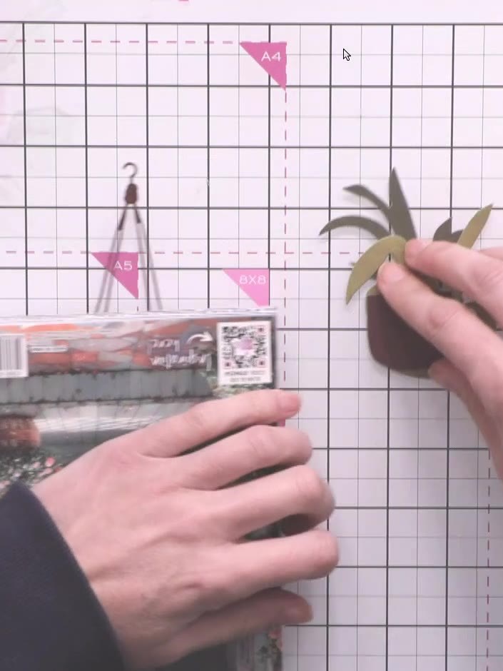 Step 6: Manipulate the die-cut basket and plant pieces to add dimension. Gently bend and curve some of the leaves and 