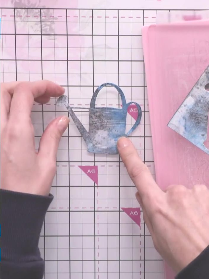 Step 11: Remove the die-cut watering can from the stencil. Apply sticky ink pad to the top, edges, sides and bottom of 