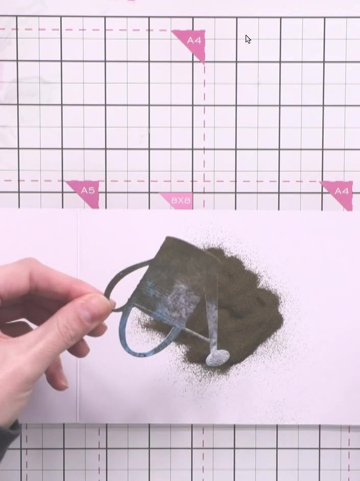 Step 12: Dust embossing powder over the inked watering can, allowing it to stick to all the wet ink areas. Tap off any 
