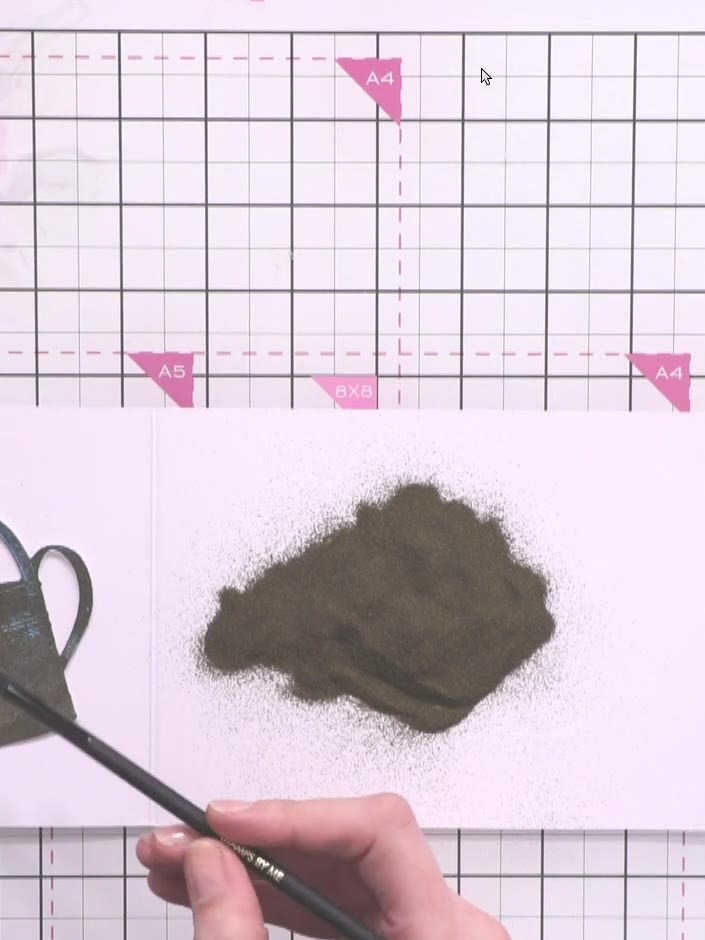 Step 13: Use a dusting brush or old paintbrush to gently brush off any excess embossing powder from areas where you don