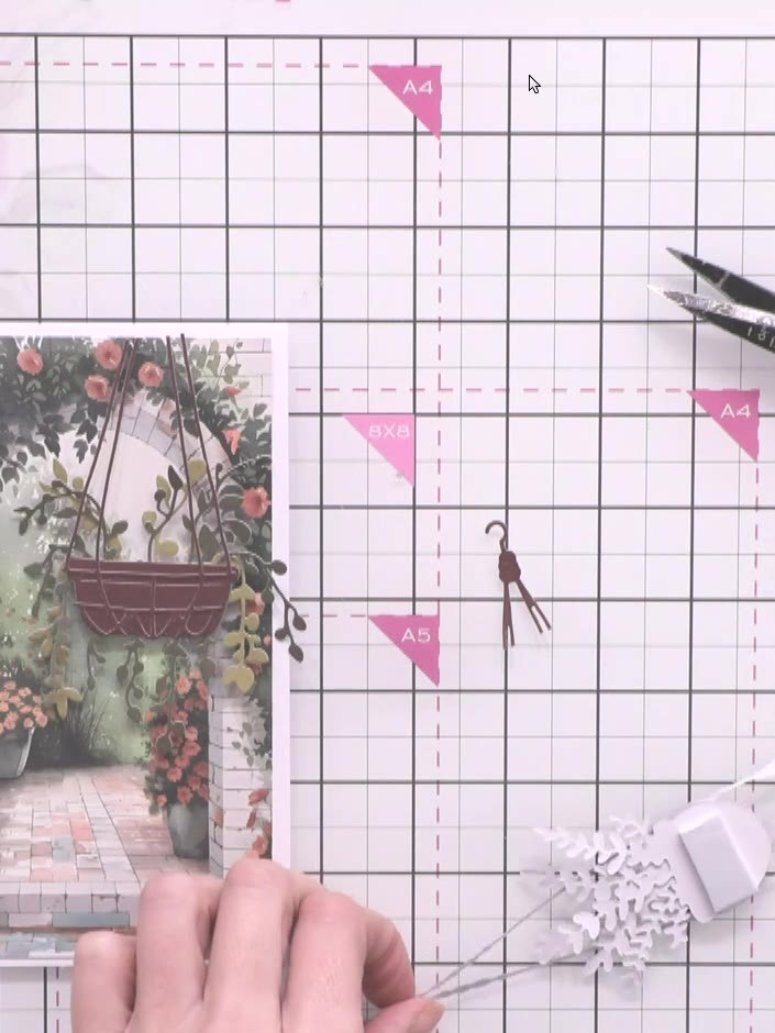 Step 10: Glue all the hanging basket pieces in place on the card, positioning them at varying heights and slightly offs