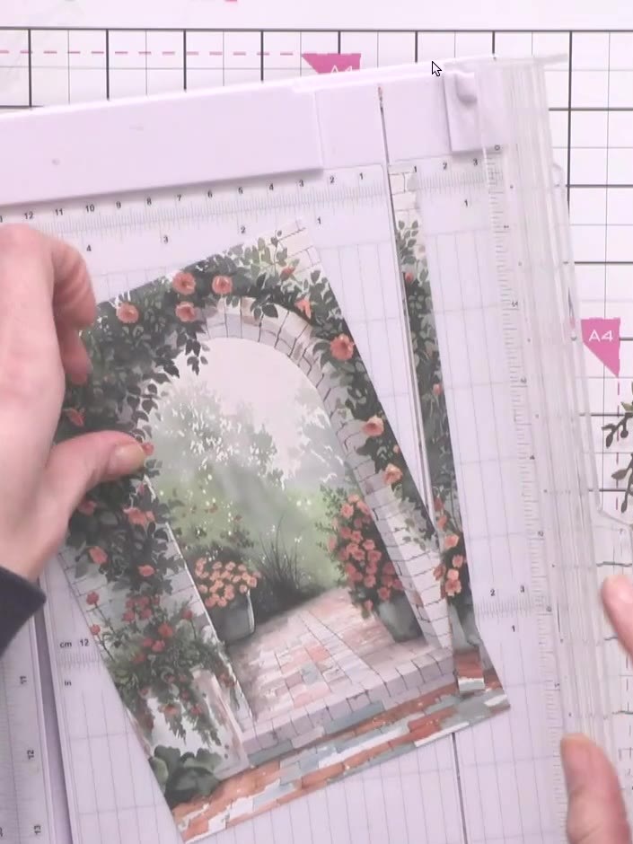 Step 2: Trim the garden scene pattern paper to fit your A4 card base. Apply adhesive to the back of the pattern paper 