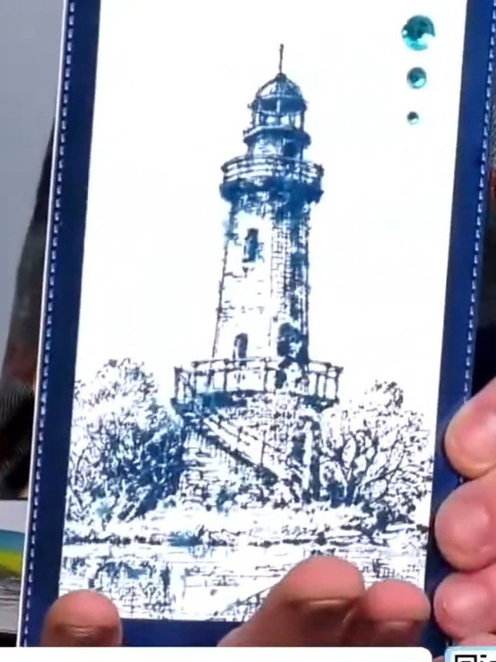 Step 4: Add watercolour details to the lighthouse stamp using gel pens or watercolour paints. Apply teal or turquoise 