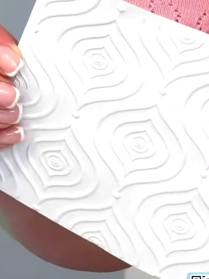 Step 3: Place your cardstock into the Moroccan Decor embossing folder. Run the folder through your die-cutting machine