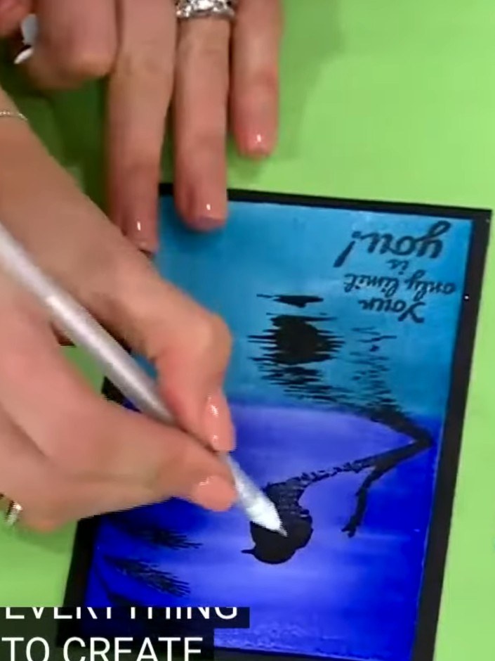 Step 3: Ink up the foliage stamp and stamp it around the bird on your card to create background and foreground element