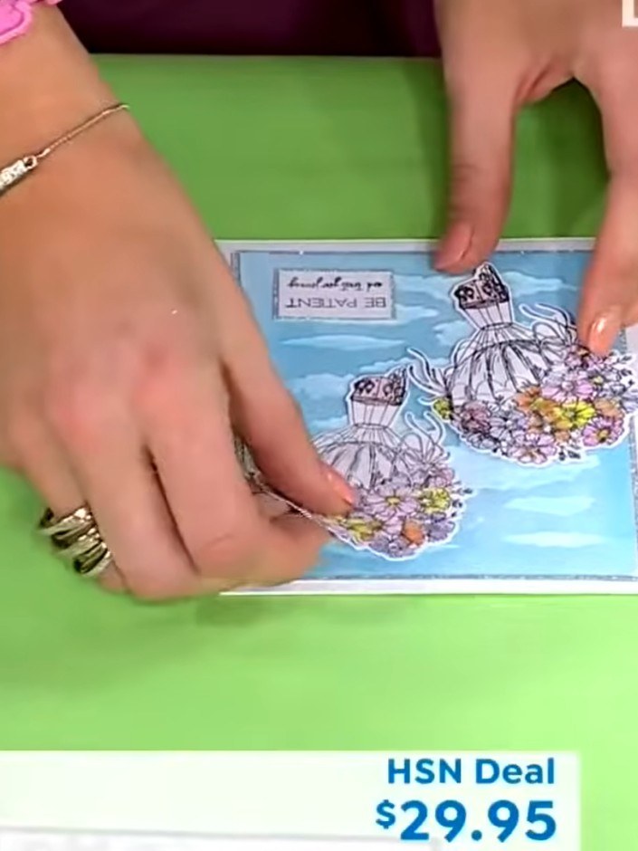 Step 5: Layer the coloured and decorated hot air balloon images onto your cloud background card to complete the scene.