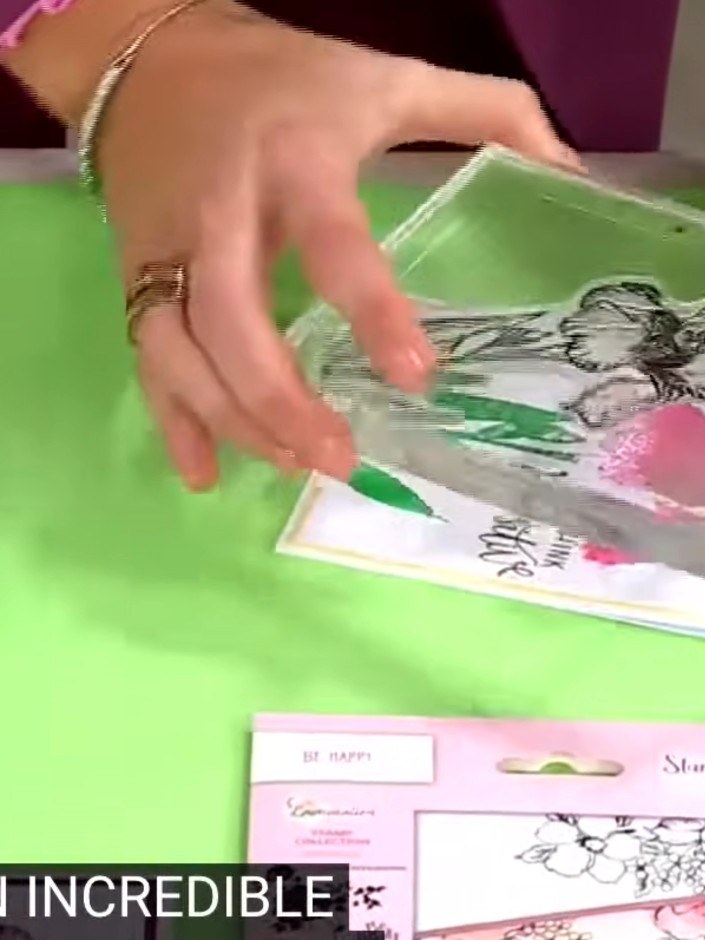 Step 3: Press the wet, coloured lamination stamp firmly onto your white card stock to transfer the watercolour design.