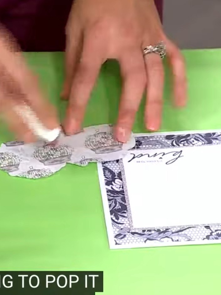 Step 2: Position the decorative vellum piece flat onto the card front. Press down firmly to adhere it in place, creati