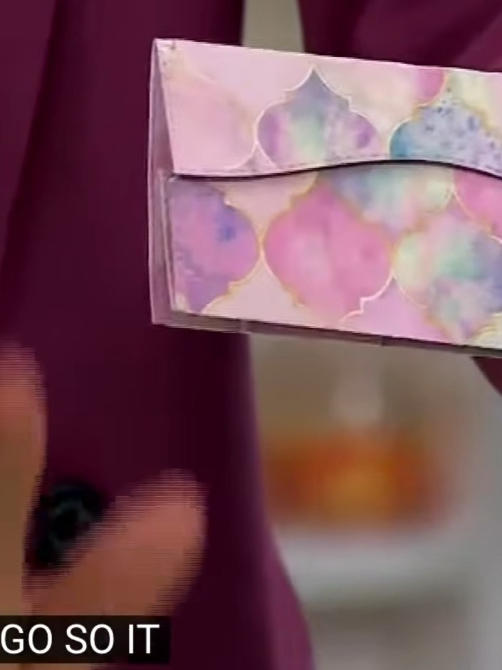 Step 4: Fold the decorative flap down over the front of the wallet. Press firmly along the fold to seal the wallet shu