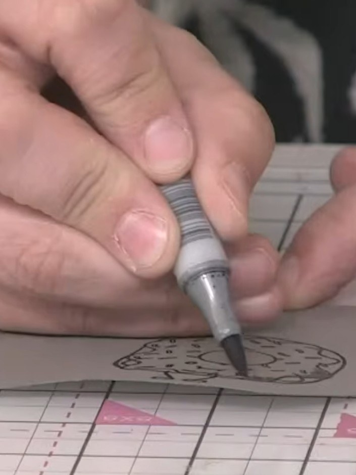 Step 5: Use a blender pen to go over the grey alcohol marker colouring on the donut. This will soften the transitions 