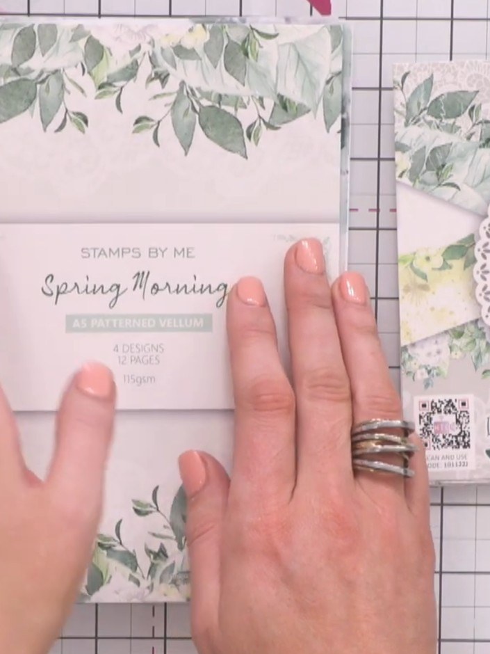 Step 1: Select papers from the Spring Morning 6x6 paper pad. Choose designs featuring green and yellow spring tones wi