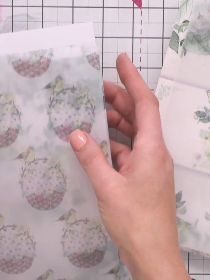 Step 5: Layer additional decorative elements from the paper collection onto your card to add dimension and visual inte