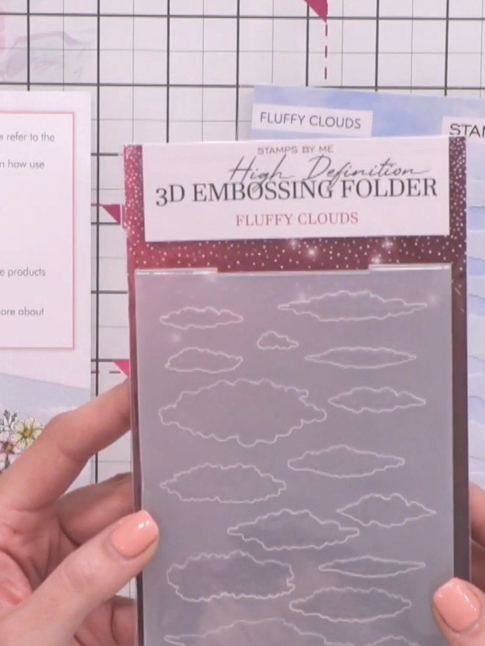 Step 3: Position the Fluffy Clouds 3D embossing folder on top of your card base to determine where you will add cloud 