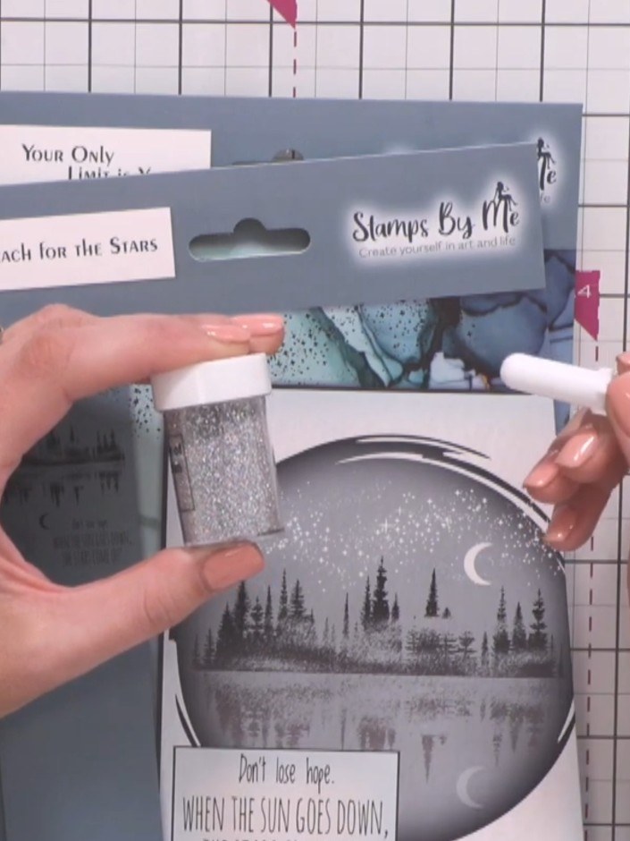 Step 5: Use the white gel pen to add highlights to the moon, creating a crescent shape. Add small dots and sparkle eff