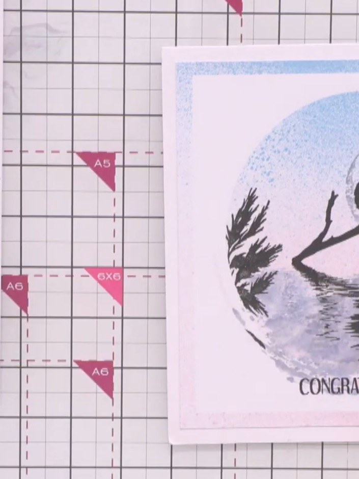 Step 6: Use stencils and coloured ink pads to add a background pattern around the moon and water reflection design. Ap