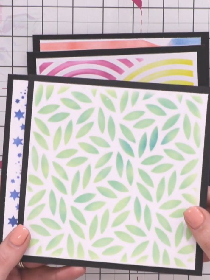Step 5: Add stamped and die-cut elements from your coordinating collection on top of the layered stencilled design to 