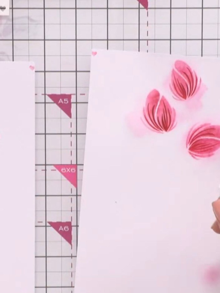 Step 10: After inking each subsequent stencil layer, lightly spray with water to create the watercolour effect. Be care