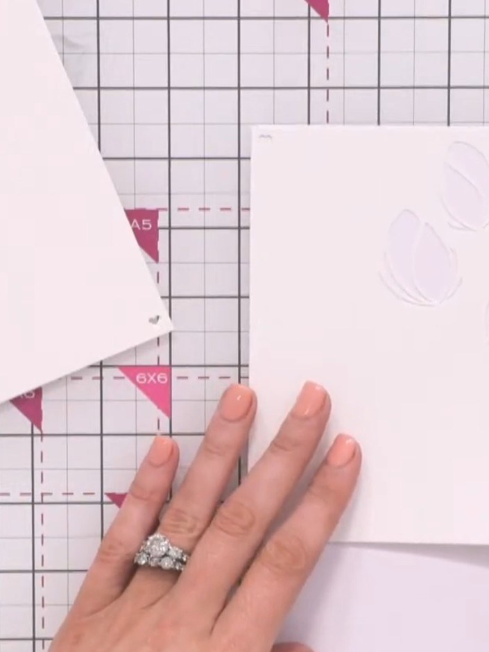 Step 2: Place stencil number one on your card base. Line up the heart registration marks in the corners to ensure prop