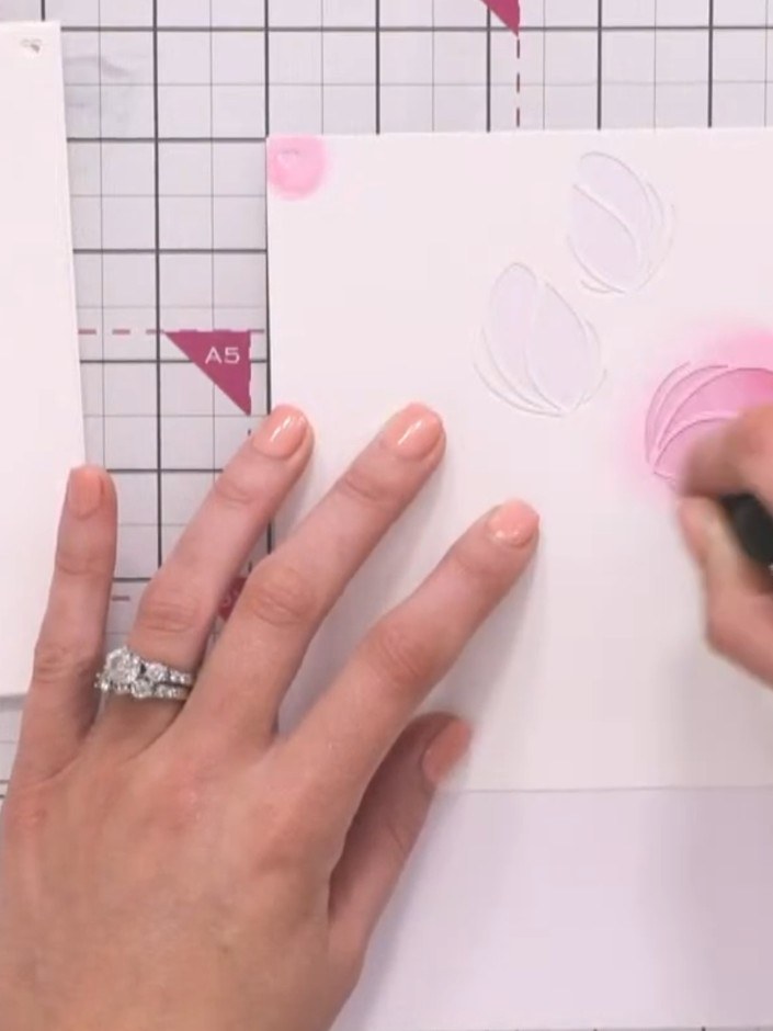 Step 4: Ink through stencil one with pink ink, pressing firmly to transfer the colour through the stencil onto the car