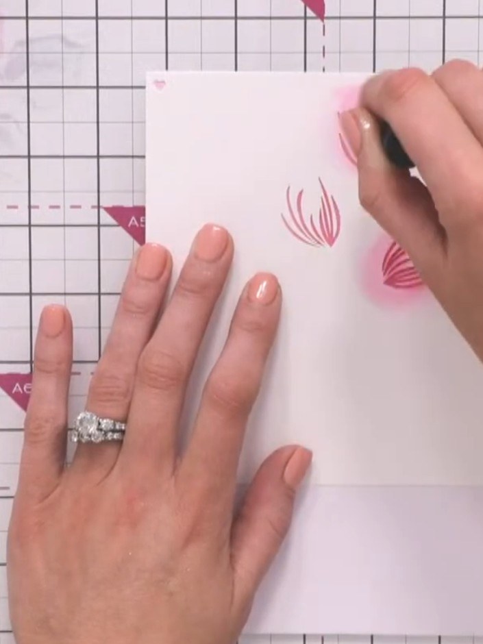 Step 5: Align stencil two using the heart registration marks and ink through with the same pink colour, pressing harde