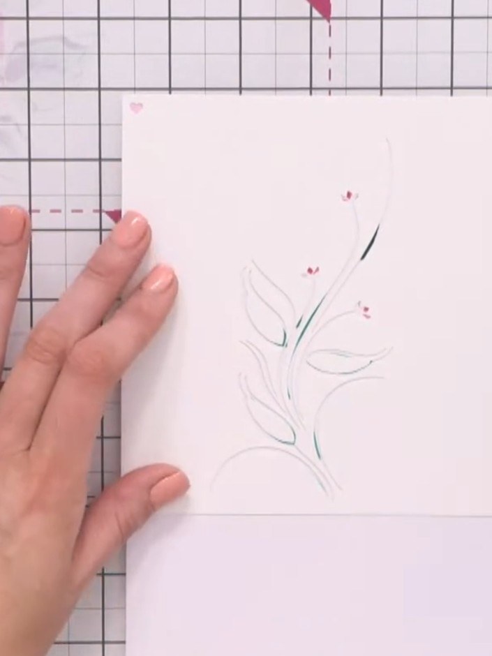 Step 7: Place stencil four on the card, aligning the registration hearts. Ink through the stencil using teal ink to ad