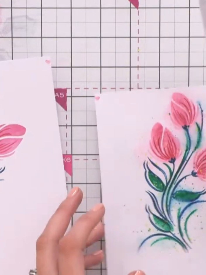 Step 1: Place an acrylic block over your completed stencilled floral design and press down firmly to flatten the card 