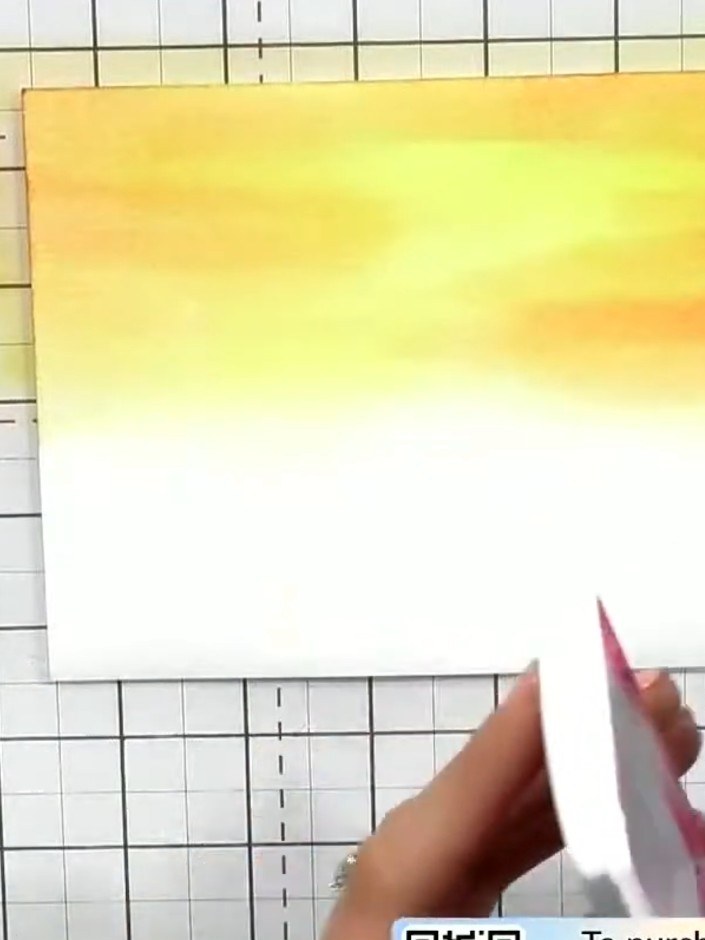 Step 3: Apply pink ink to the card, blending it with the yellow to create a tropical sunset effect. Work the pink colo