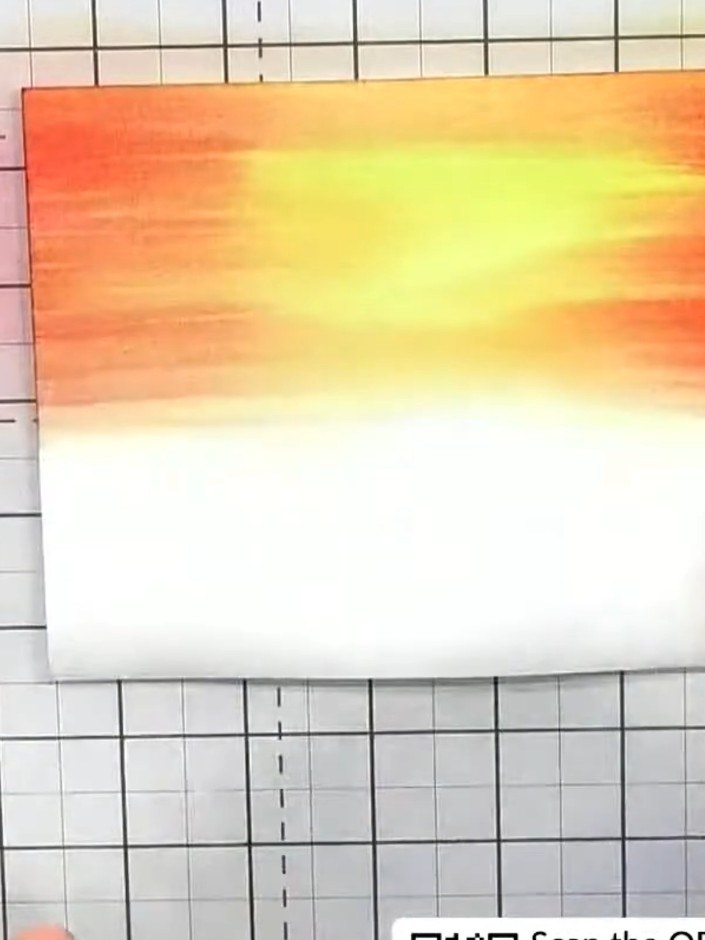 Step 5: Use your heat tool to blast off excess water from the watercoloured panel. This will lighten the colours and c