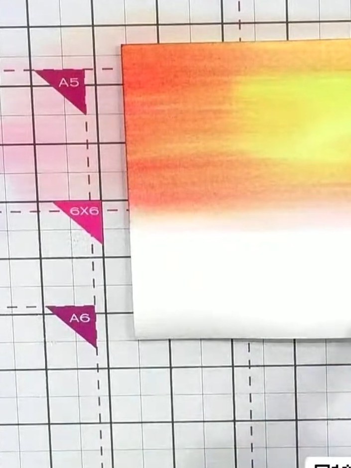 Step 6: Use a clean, damp brush to lift out a circular area in the centre of the sunset for the sun, creating a bright