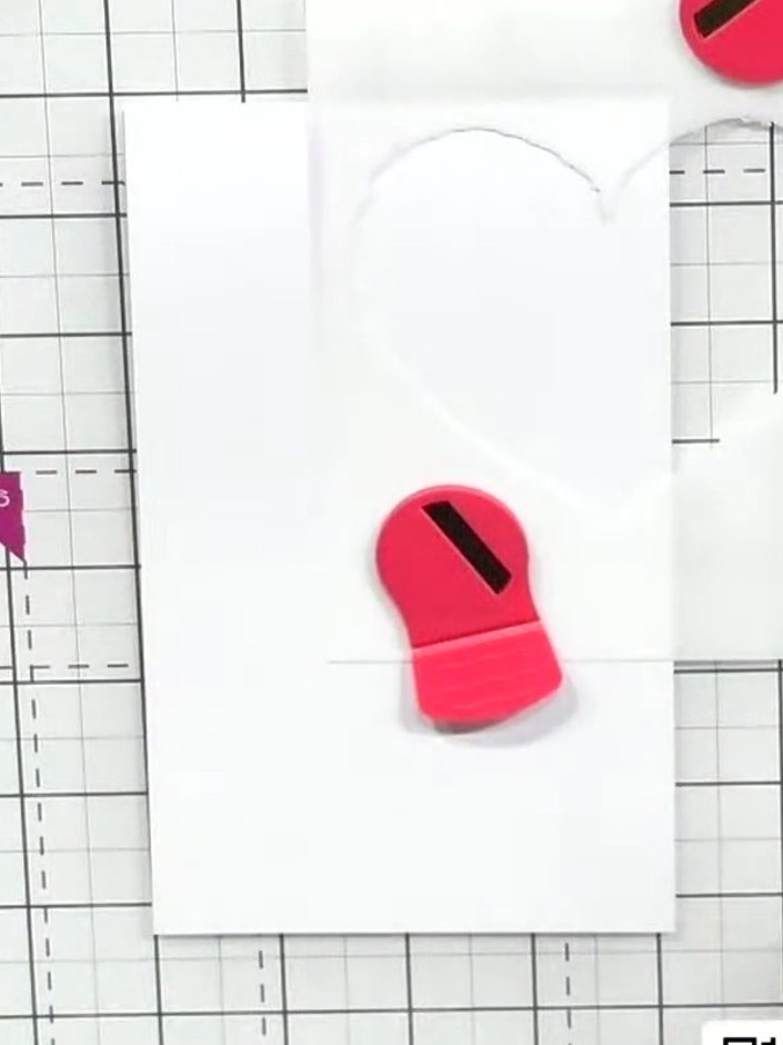 Step 1: Position the heart stencil on your white card base. Hold it in place using a magnetic mat to keep it steady wh