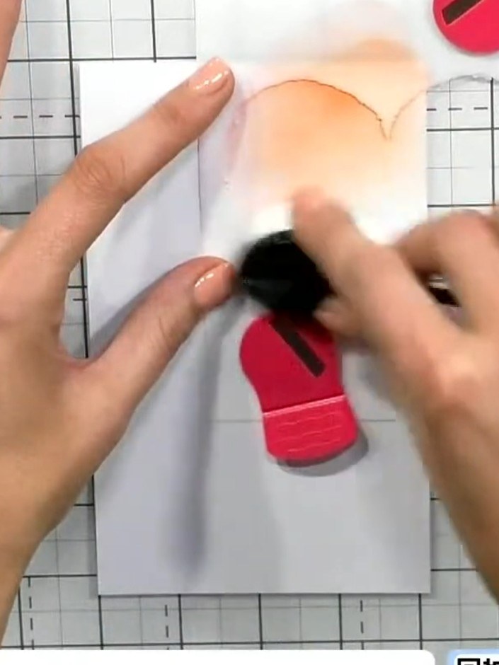 Step 2: Apply orange ink very lightly to the top section of the card through the heart stencil, using a blending tool 