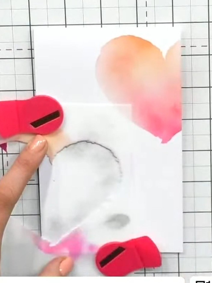 Step 4: Move the heart stencil to the lower section of the card. Apply black ink through the stencil using a blending 