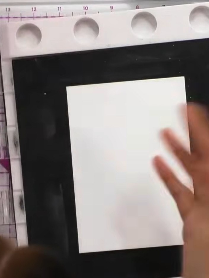 Step 3: Press the stamp firmly down onto the white watercolour card. Lift the stamp away cleanly to reveal the waterco