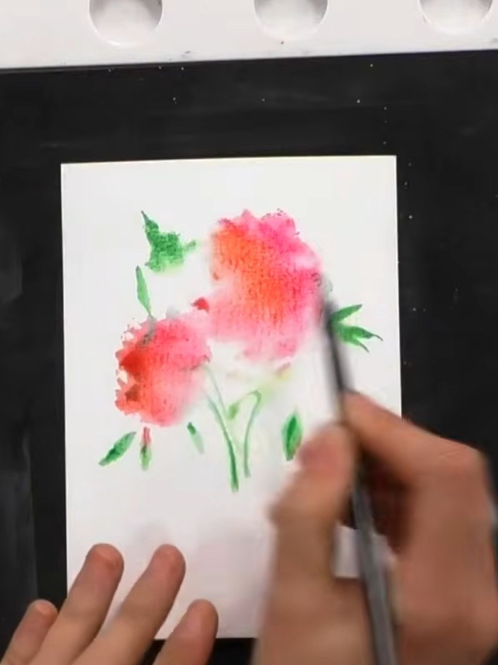 Step 4: Dry the stamped watercolour image completely using a heat gun. Hold the heat gun above the card and move it ge