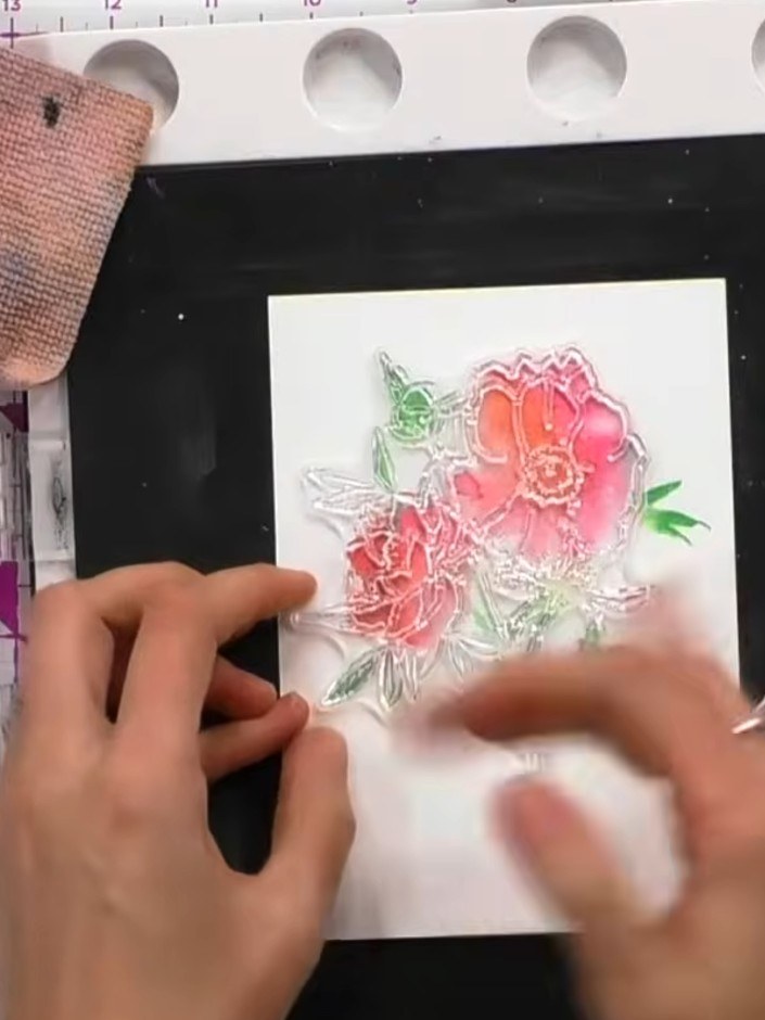 Step 6: Stamp the detailed line work stamp over the dried watercolour flowers to add definition and outline details to