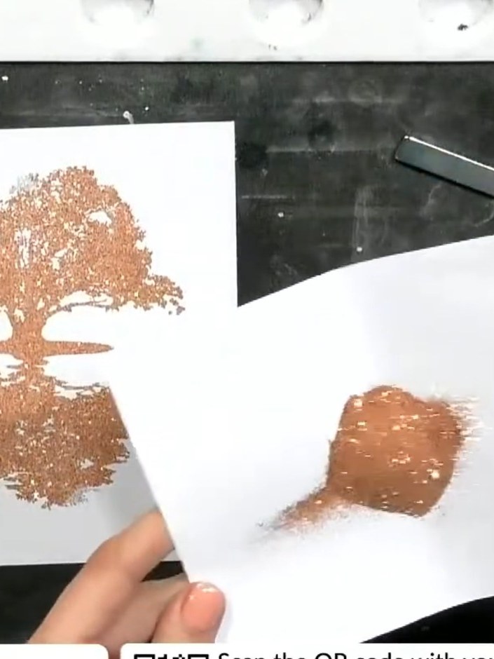 Step 4: Sprinkle clear embossing powder over the stamped tree design. Tap off the excess powder and use a heat tool to