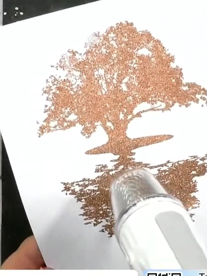 Step 6: Run the stamped card through an HD 3D embossing folder to add texture and dimension to the tree image. The emb