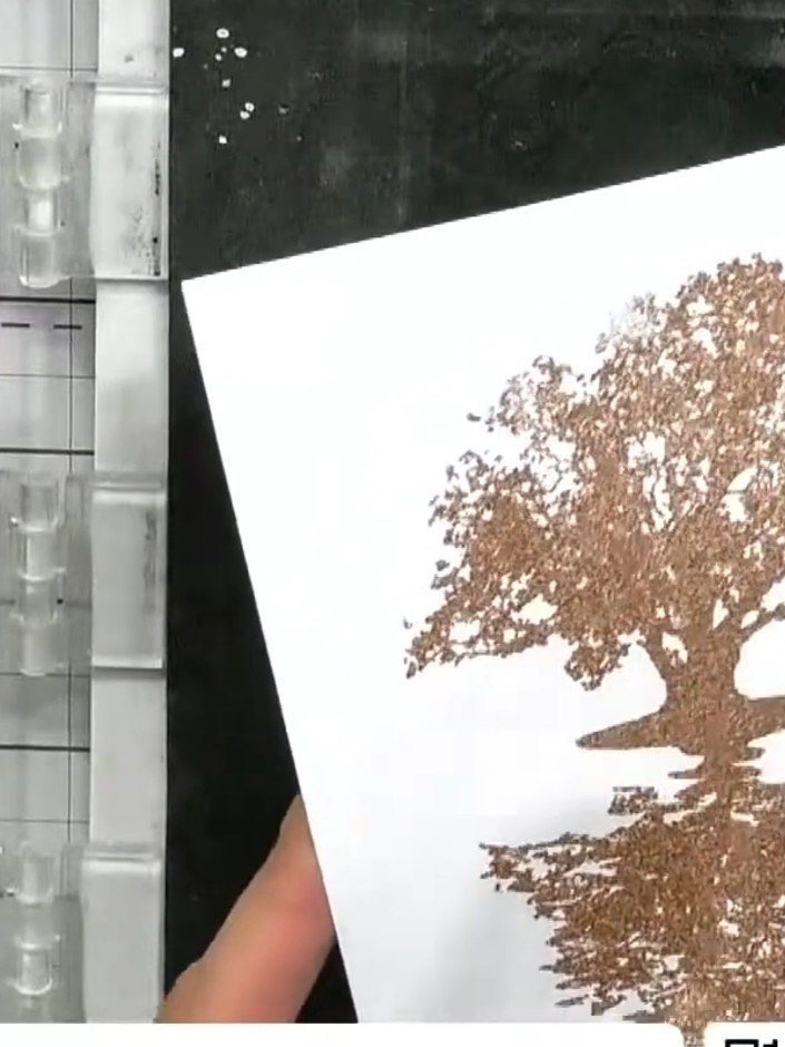 Step 7: Trim the card to your desired size, keeping the embossed tree design as your focal point. Use a trimmer or sci