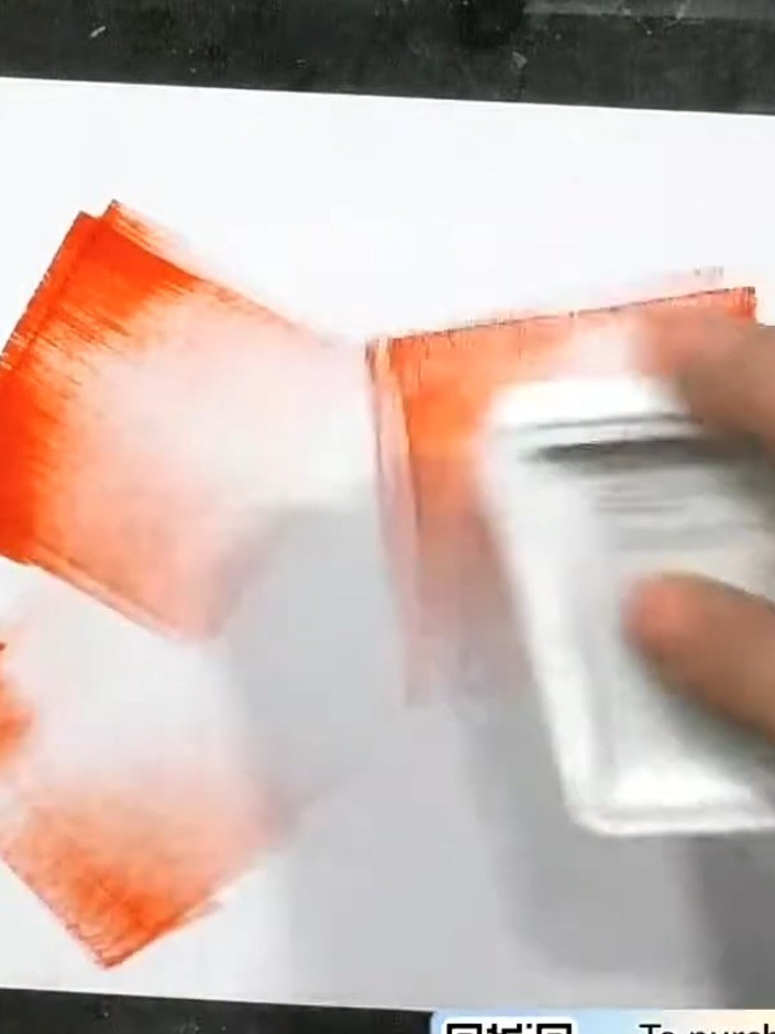 Step 1: Swipe your ink pad across the white card in different directions to create a distressed, multi-coloured backgr