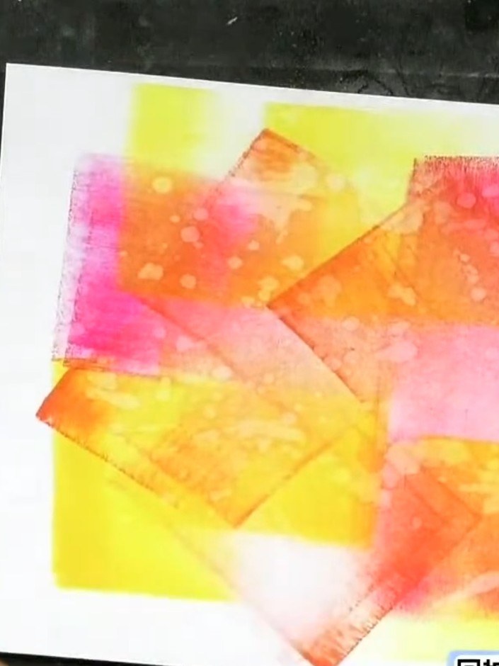 Step 4: Spray water droplets onto the inked surface to activate the reactive ink and create texture. The water will ca