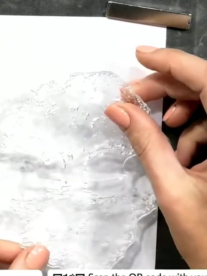 Step 2: Stamp the same tree image lower on the white card using black ink. Immediately stamp the inked tree onto scrap