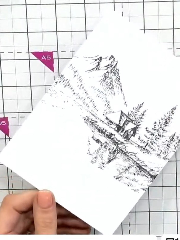 Step 5: Spray the top portion of the stamped card with water to activate the waterproof ink and create a watercolour e