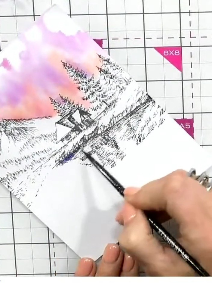 Step 7: Apply darker blue watercolour to the water reflection area at the base of the stamped design. Use a pen or bru