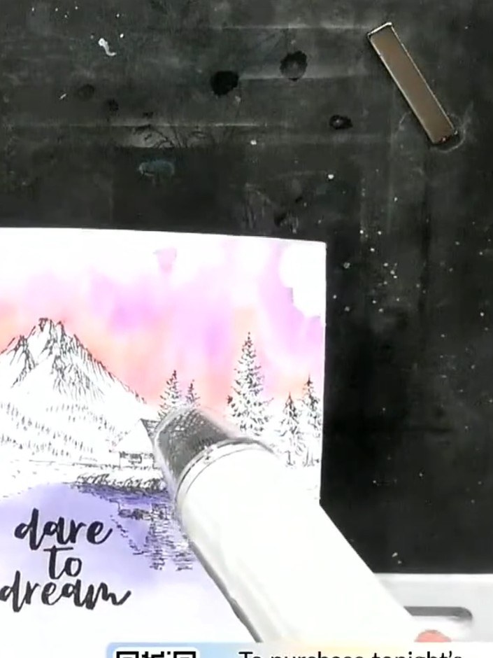 Step 8: Apply coloured sparkle pens in red, green and gold over the stamped mountain, trees and reflection elements. T