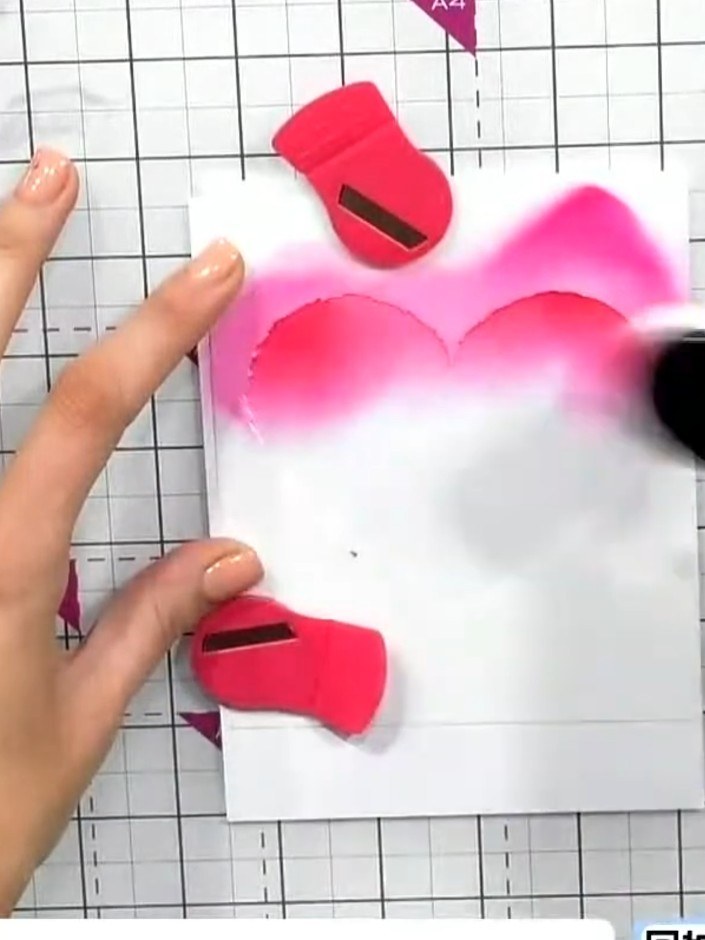 Step 2: Apply pink ink through the heart stencil using a large blending brush, working from the top of the heart downw